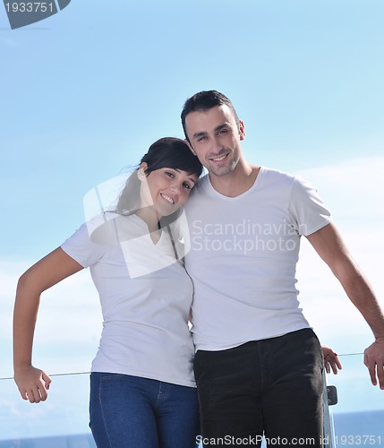 Image of couple relaxing on balcony