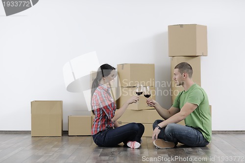 Image of Young couple moving in new home