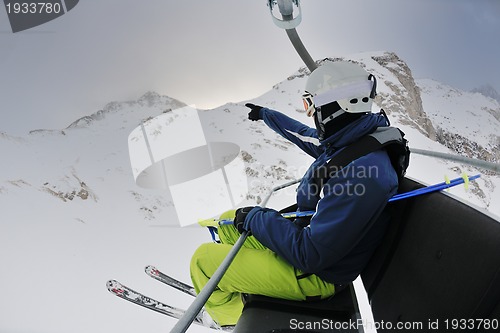 Image of skiing on fresh snow at winter season at beautiful sunny day