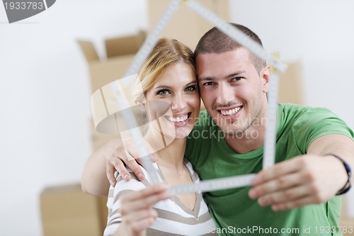 Image of Young couple moving in new house