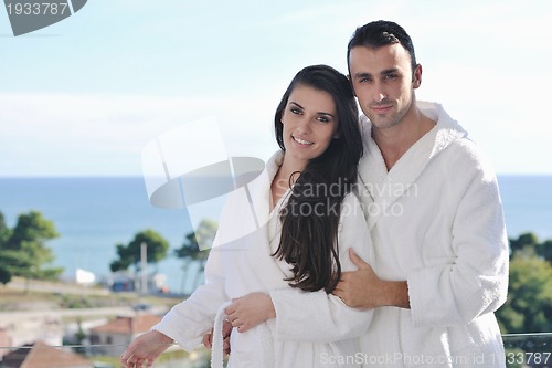 Image of couple relaxing on balcony