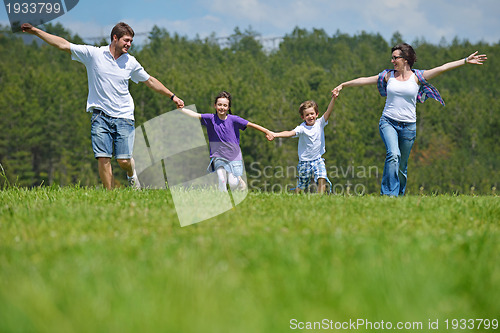 Image of happy young family have fun outdoors