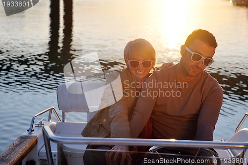 Image of couple in love  have romantic time on boat