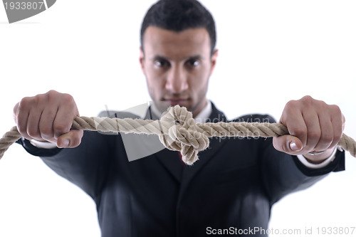 Image of business man with rope isolated on white background