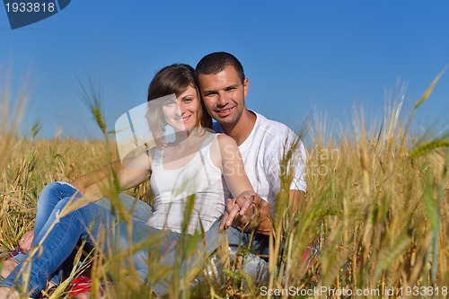 Image of happy couple in wheat field