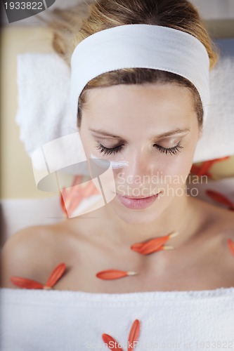 Image of Beautiful young woman in spa