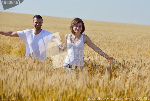 Image of happy couple in wheat field