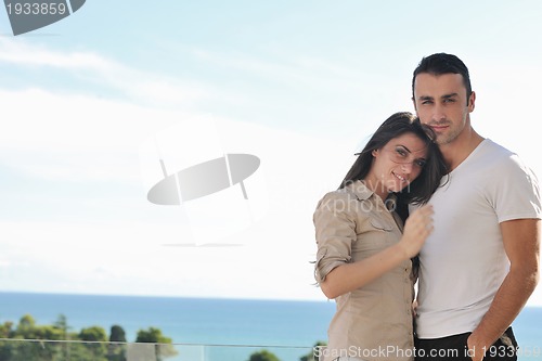 Image of couple relaxing on balcony