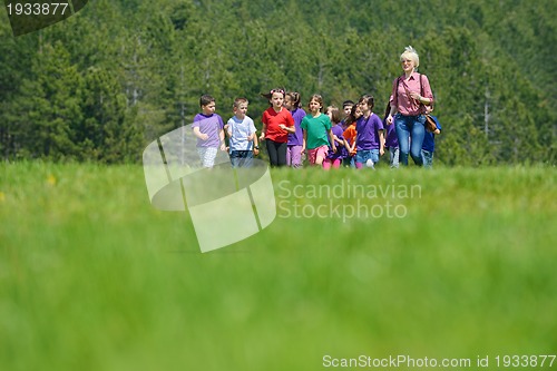 Image of happy kids group  have fun in nature