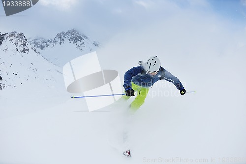 Image of skiing on fresh snow at winter season at beautiful sunny day