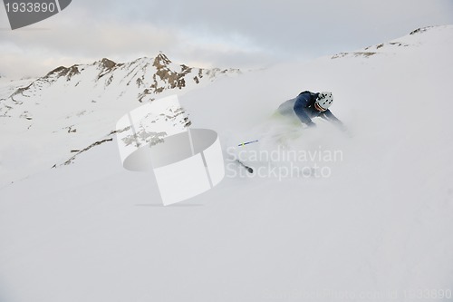Image of skiing on fresh snow at winter season at beautiful sunny day