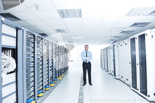 Image of young it engeneer in datacenter server room