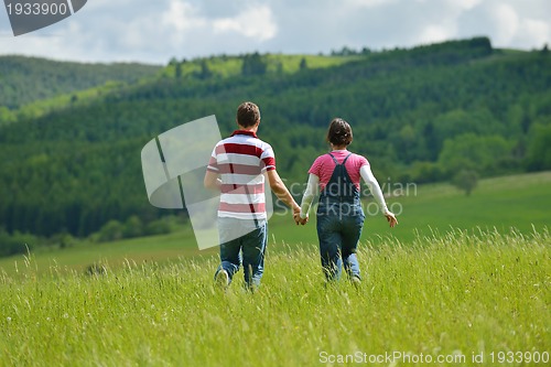 Image of romantic young couple in love together outdoor