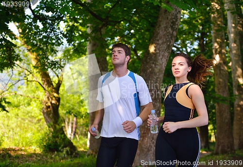 Image of Young couple jogging