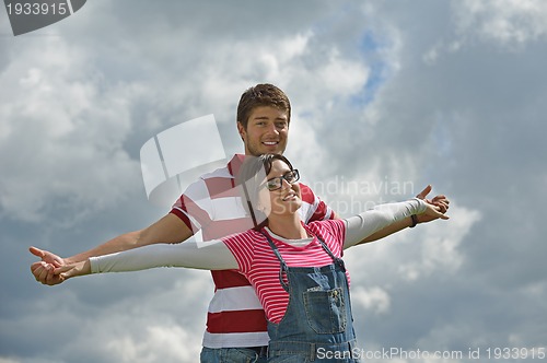 Image of romantic young couple in love together outdoor