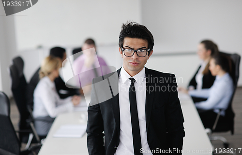 Image of young business man at meeting