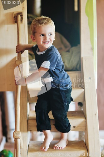 Image of beautiful young child making first steps