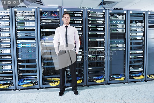 Image of young it engeneer in datacenter server room