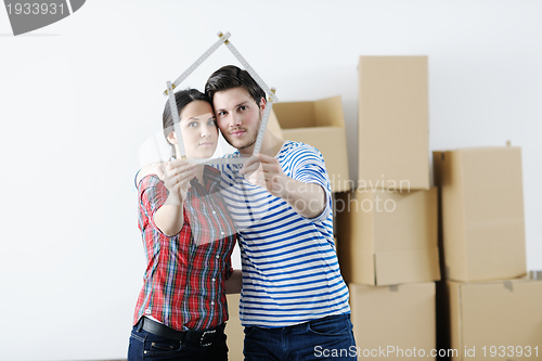 Image of Young couple moving in new house