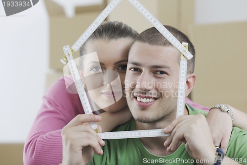 Image of Young couple moving in new home