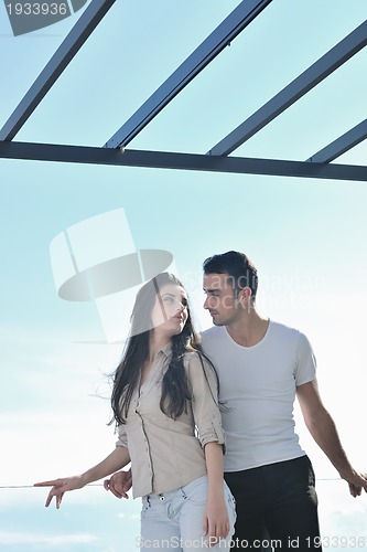 Image of couple relaxing on balcony