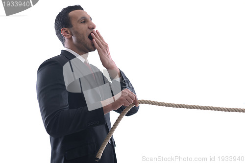 Image of business man with rope isolated on white background