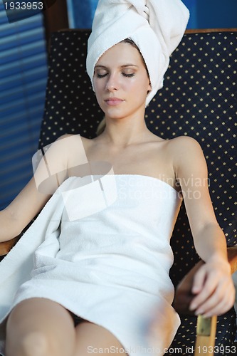 Image of Beautiful young woman in spa