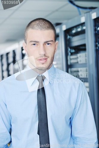 Image of young it engeneer in datacenter server room