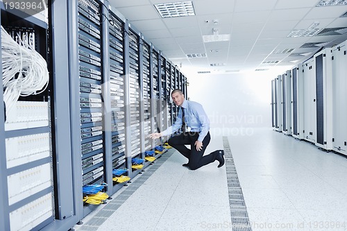 Image of young it engineer in datacenter server room