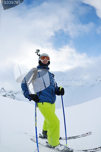 Image of skiing on fresh snow at winter season at beautiful sunny day