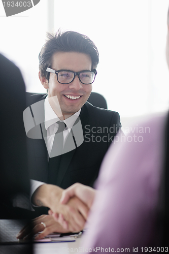 Image of young business man at meeting