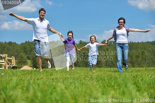 Image of happy young family have fun outdoors