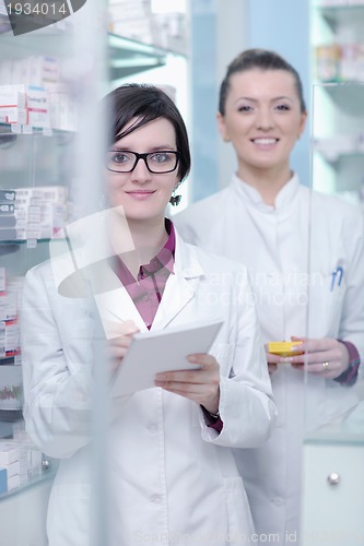 Image of team of pharmacist chemist woman  in pharmacy drugstore