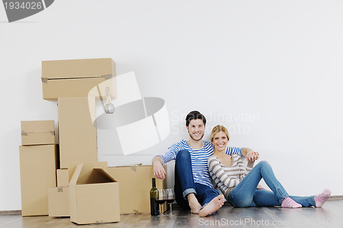 Image of Young couple moving in new house