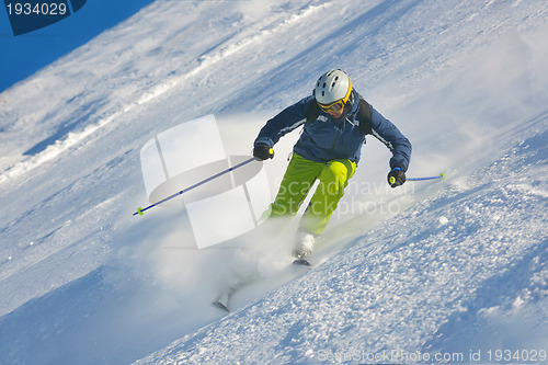 Image of skiing on fresh snow at winter season at beautiful sunny day