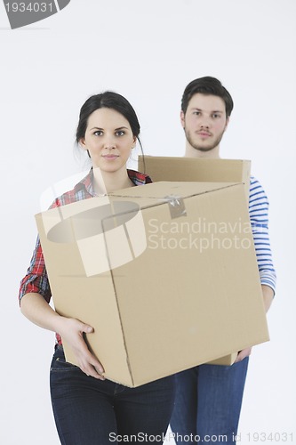 Image of Young couple moving in new home