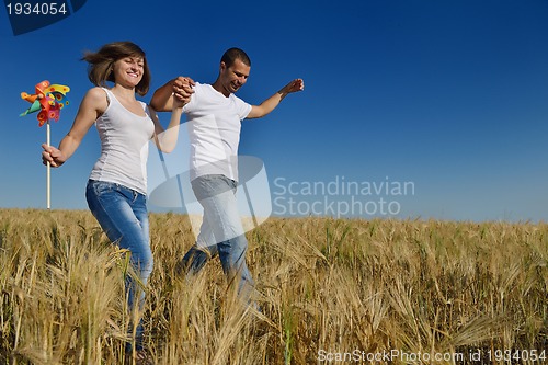 Image of happy couple in wheat field