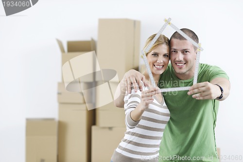 Image of Young couple moving in new home