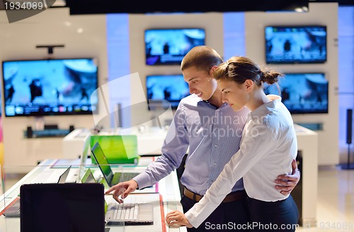 Image of people buy  in consumer electronics store