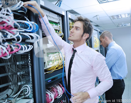 Image of it enineers in network server room