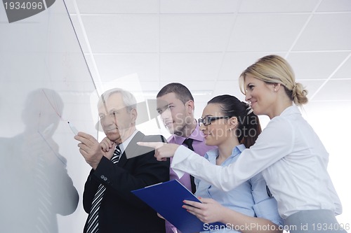 Image of Senior business man giving a presentation