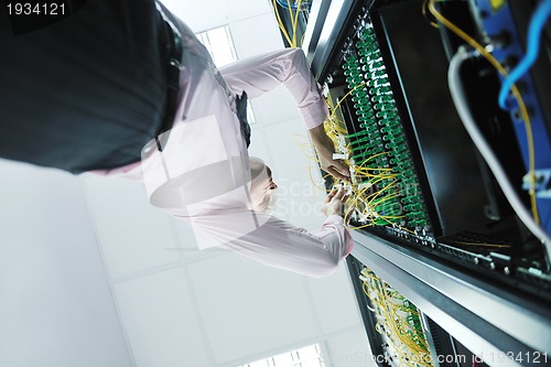 Image of young it engeneer in datacenter server room