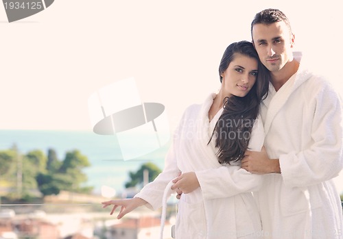 Image of couple relaxing on balcony