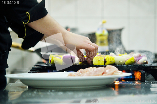 Image of chef preparing meal