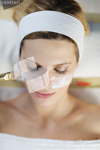 Image of Beautiful young woman in spa