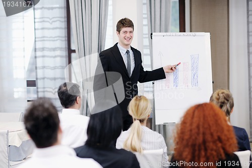 Image of Young  business man giving a presentation on conference