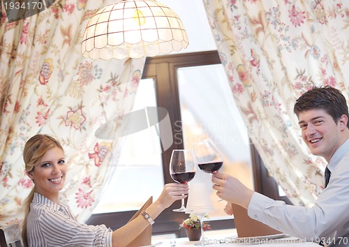 Image of young couple having dinner at a restaurant