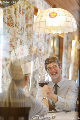 Image of young couple having dinner at a restaurant