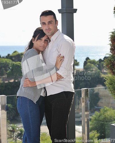 Image of couple relaxing on balcony
