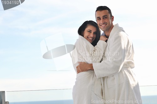 Image of couple relaxing on balcony